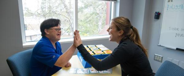 Clinic students working with elementary aged children